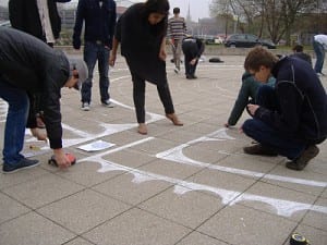 University of Lincoln School of Architecture students drawing a chalk labyrinth 